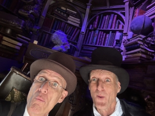 Walking act: The Brothers Grimm, collectors of fairy tales, in their library